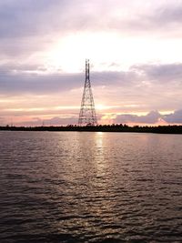 Silhouette sailboat on sea against sky during sunset