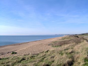 Scenic view of beach against sky