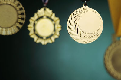 Close-up of medals against blackboard