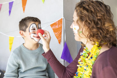 Cheerful mother with son at home