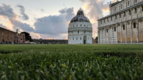 Piazza dei miracoli against sky during sunset in city