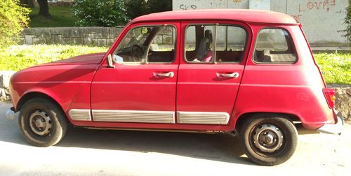 Red vintage car on road