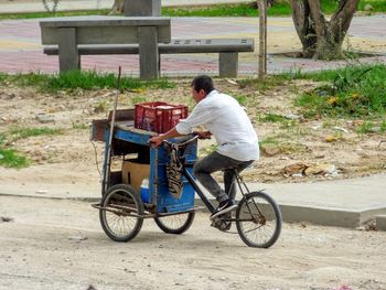 Side view of man riding motorcycle