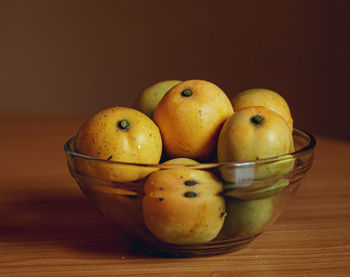 Close-up of fruits in bowl on table