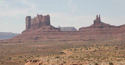 Scenic view of rock formations against sky