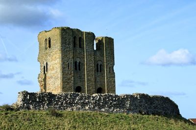 Low angle view of old ruin against sky