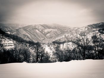 Scenic view of mountains against sky during winter