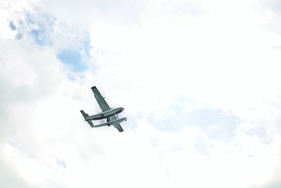 Low angle view of airplane against sky