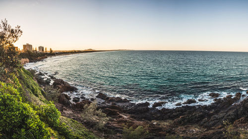 Scenic view of sea against clear sky during sunset