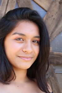 Close-up portrait of smiling young woman