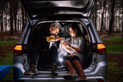 People sitting in car