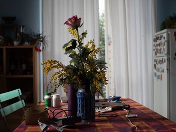 Flower vase on table at home