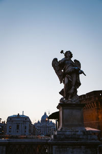 Low angle view of statue against sky