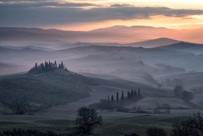 Scenic view of landscape against sky during sunset