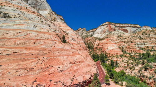 Scenic view of mountains against clear blue sky