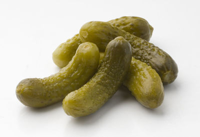 Close-up of cucumbers against white background