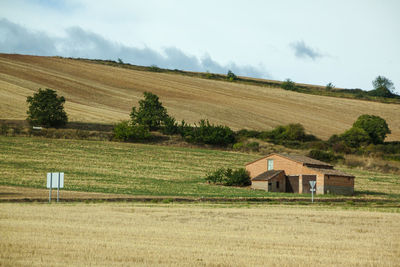 House on field against sky