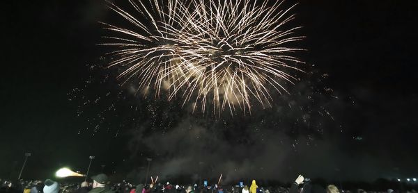 Firework display at night