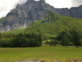 Scenic view of landscape and mountains against sky