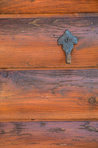 Full frame shot of old wooden door with keyhole