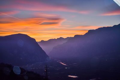 Scenic view of silhouette mountains against sky during sunset