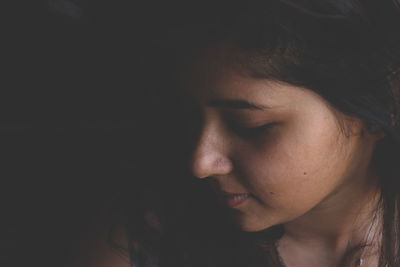 Close-up of young woman with eyes closed