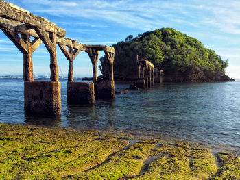 Old bridge over over sea to island