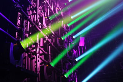 Low angle view of illuminated lights at night