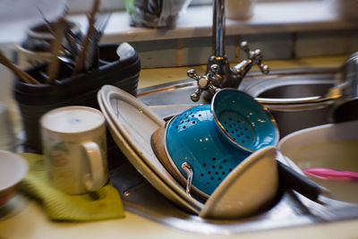 Close up of kitchen utensils in sink
