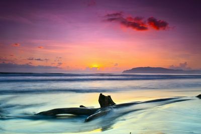 Scenic view of sea against sky during sunset