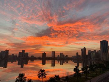 Scenic view of buildings against sky during sunset