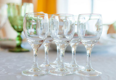 Close-up of wine glasses on table