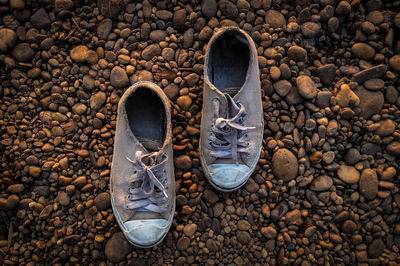 High angle view of shoes on stone