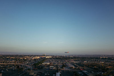 High angle view of buildings against clear blue sky