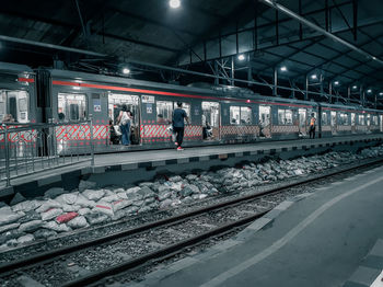 People waiting at railroad station platform