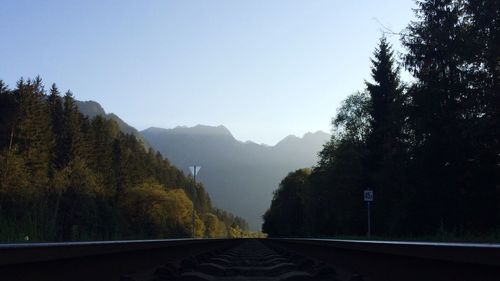 Empty road leading towards mountains