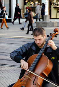 Friends playing on street in city