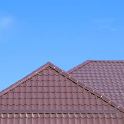 Low angle view of roof against clear blue sky