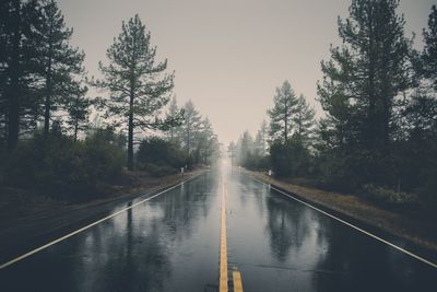 Empty highway in rain. perfect asphalt mountain road in overcast rainy