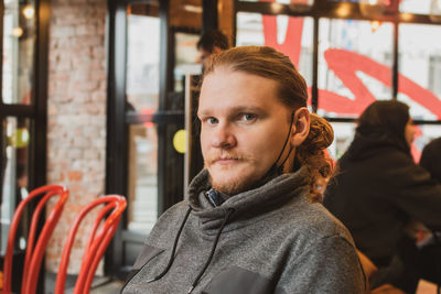 Portrait of man sitting at cafe