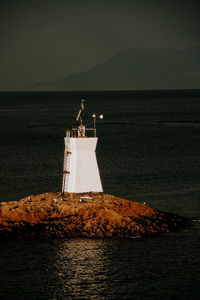 Small lighthouse off the coast of mallaig, western scotland.