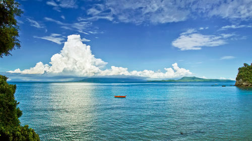 Scenic view of sea against blue sky