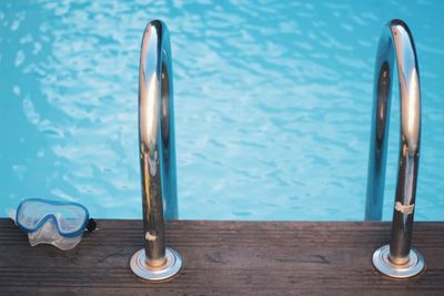 High angle view of railing at poolside