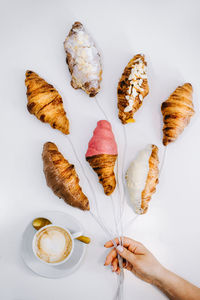 High angle view of coffee beans against white background