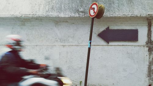 Blurred motion of man riding motorcycle