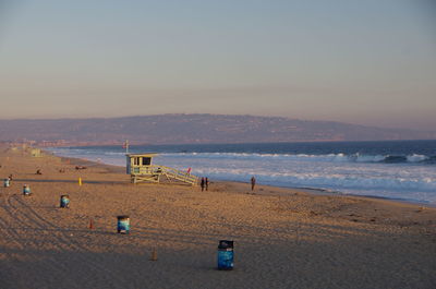 Scenic view of beach at sunset