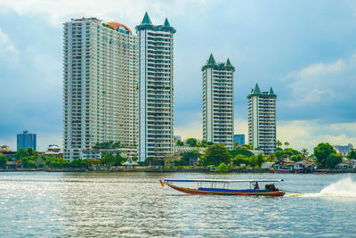 Low angle view of modern buildings in city against sky