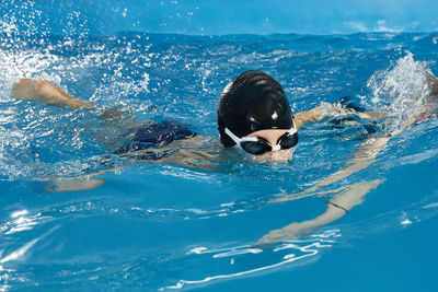 Woman swimming in pool