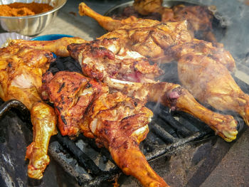 High angle view of meat on barbecue grill