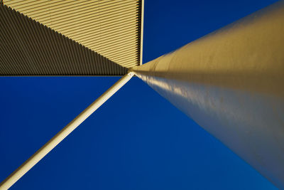 Low angle view of building against clear blue sky